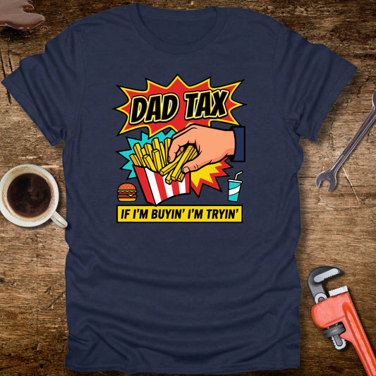 Navy blue t-shirt with a graphic design on a wooden surface with tools and a cup.