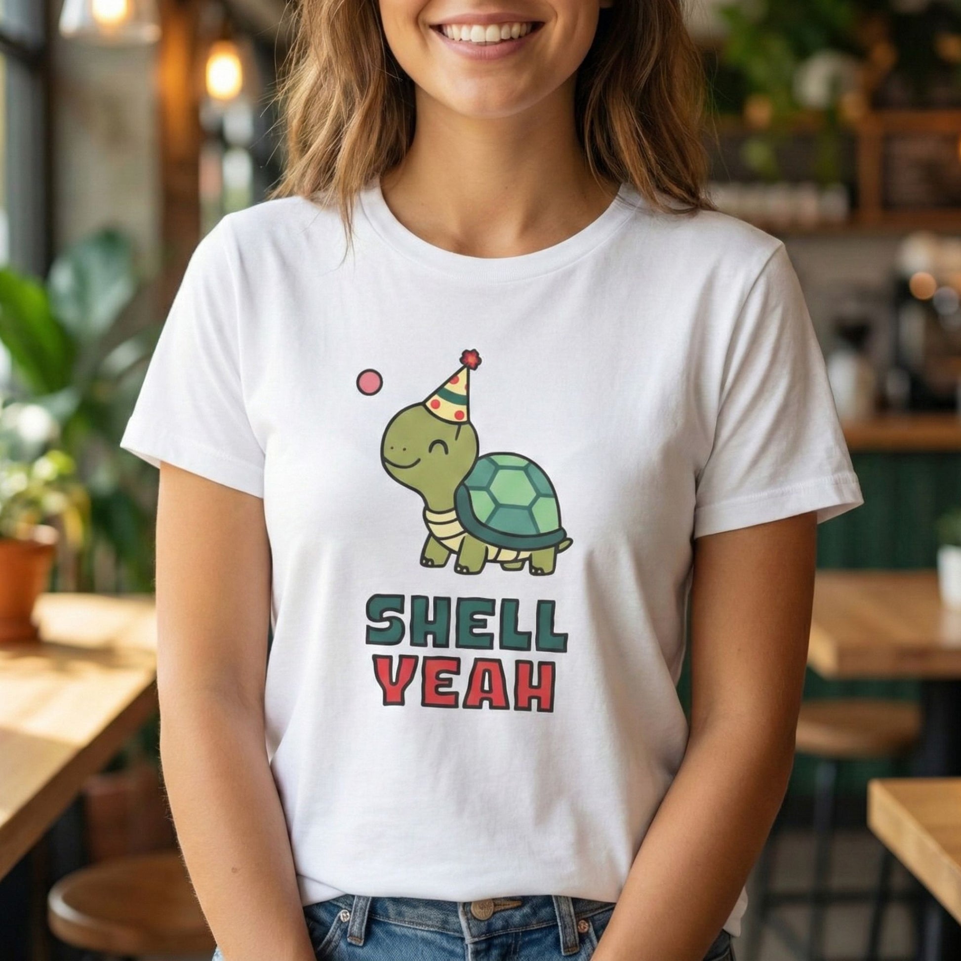 Person wearing a white t-shirt with a turtle graphic and 'Shell Yeah' text in a casual setting.