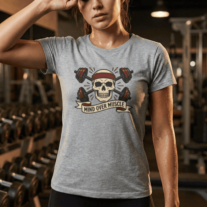Person wearing a gray t-shirt with a skull and barbell graphic in a gym setting