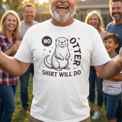Man wearing a t-shirt with an otter graphic and text, standing outdoors with a group of people.