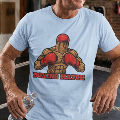 Man wearing a light blue t-shirt with a boxing-themed graphic and 'Boxing Match' text, standing in a boxing ring.