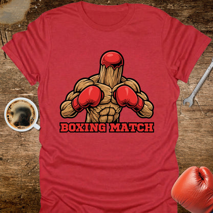 Red t-shirt with boxing graphic and 'Boxing Match' text on a wooden surface with coffee and gloves.