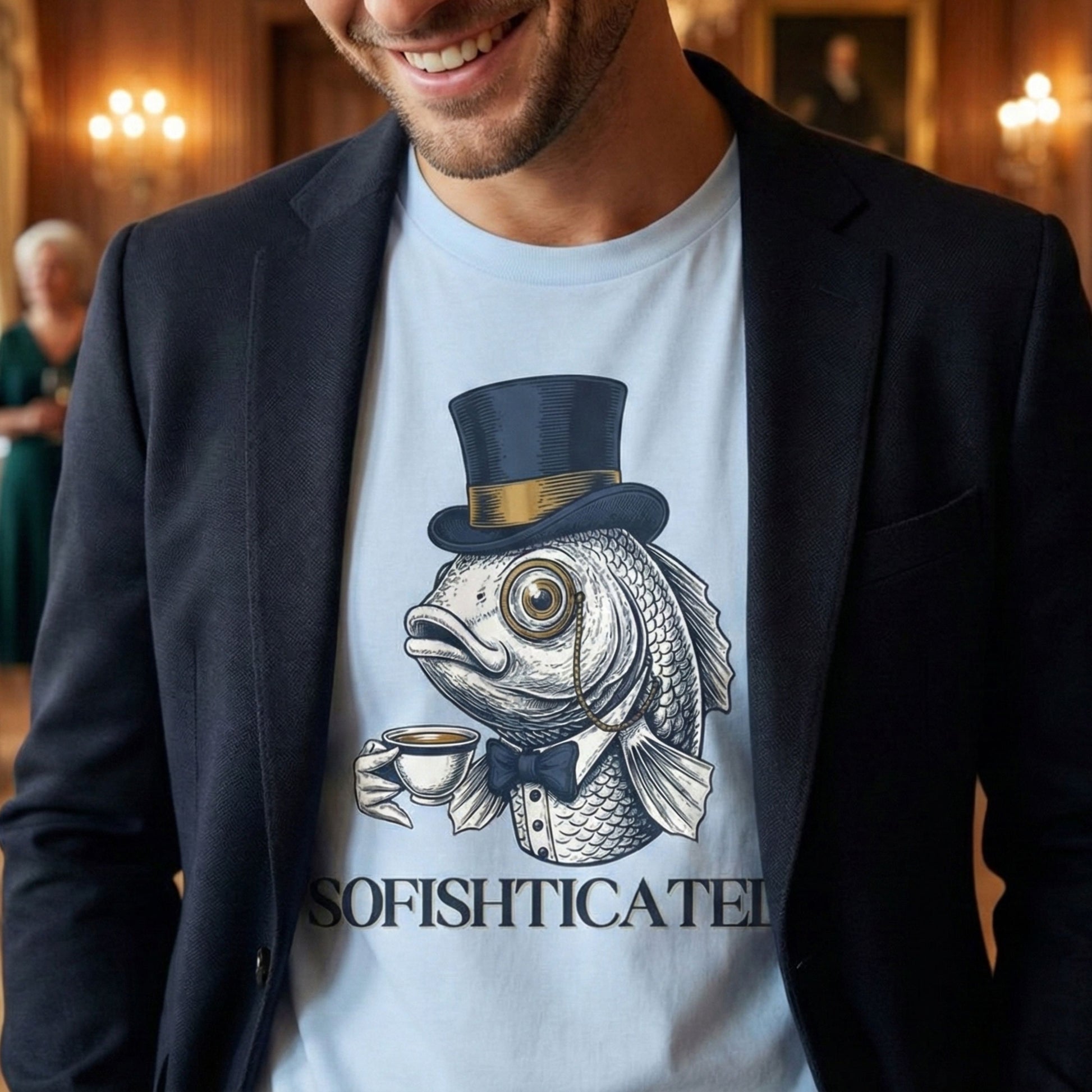 Man wearing a t-shirt with a fish wearing a top hat and bow tie design, text 'SOFISHTICATED', in an indoor setting.