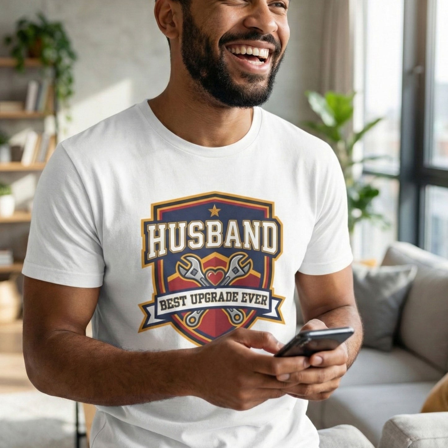 Man wearing a white t-shirt with 'Husband Best Upgrade Ever' design, holding a phone indoors.