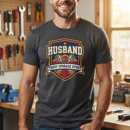 Man wearing a t-shirt with 'Husband Best Upgrade Ever' design in a workshop.