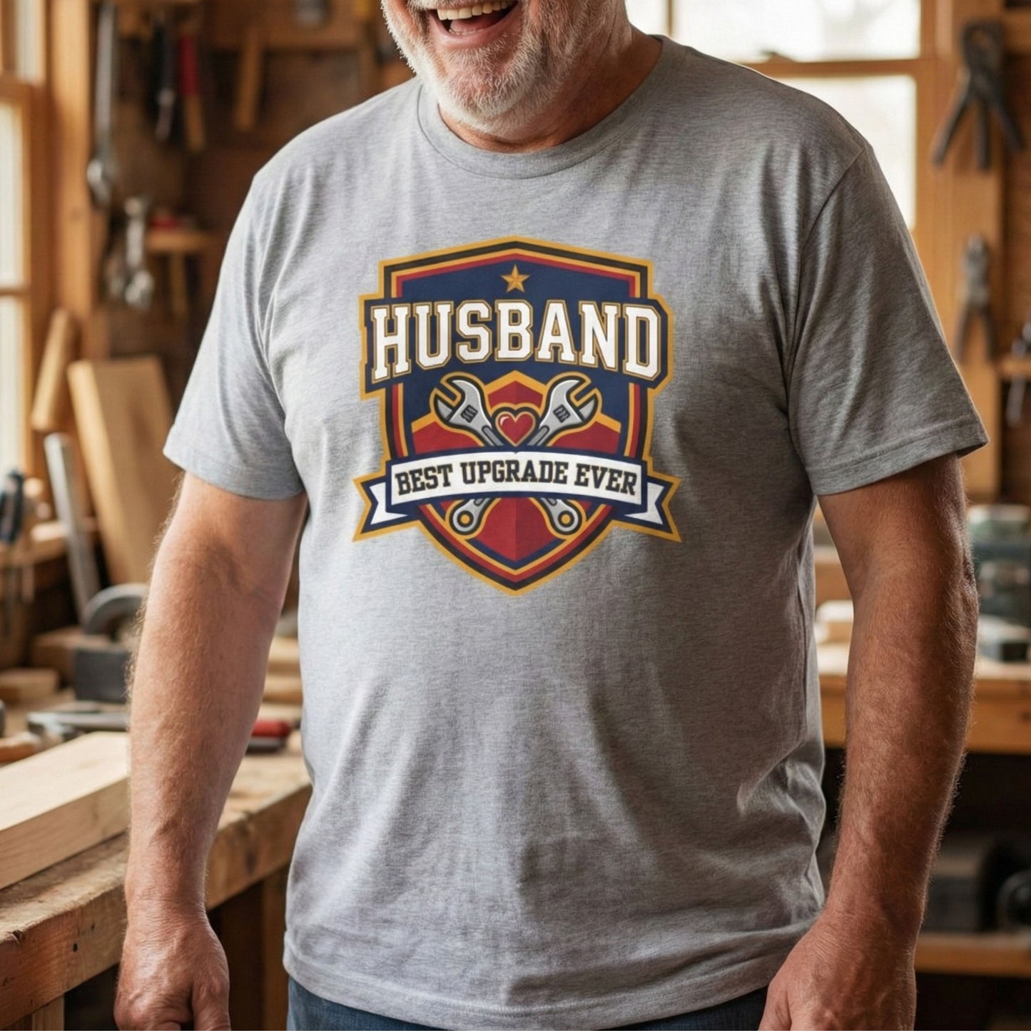 Man wearing a gray t-shirt with 'Husband Best Upgrade Ever' graphic in a workshop.