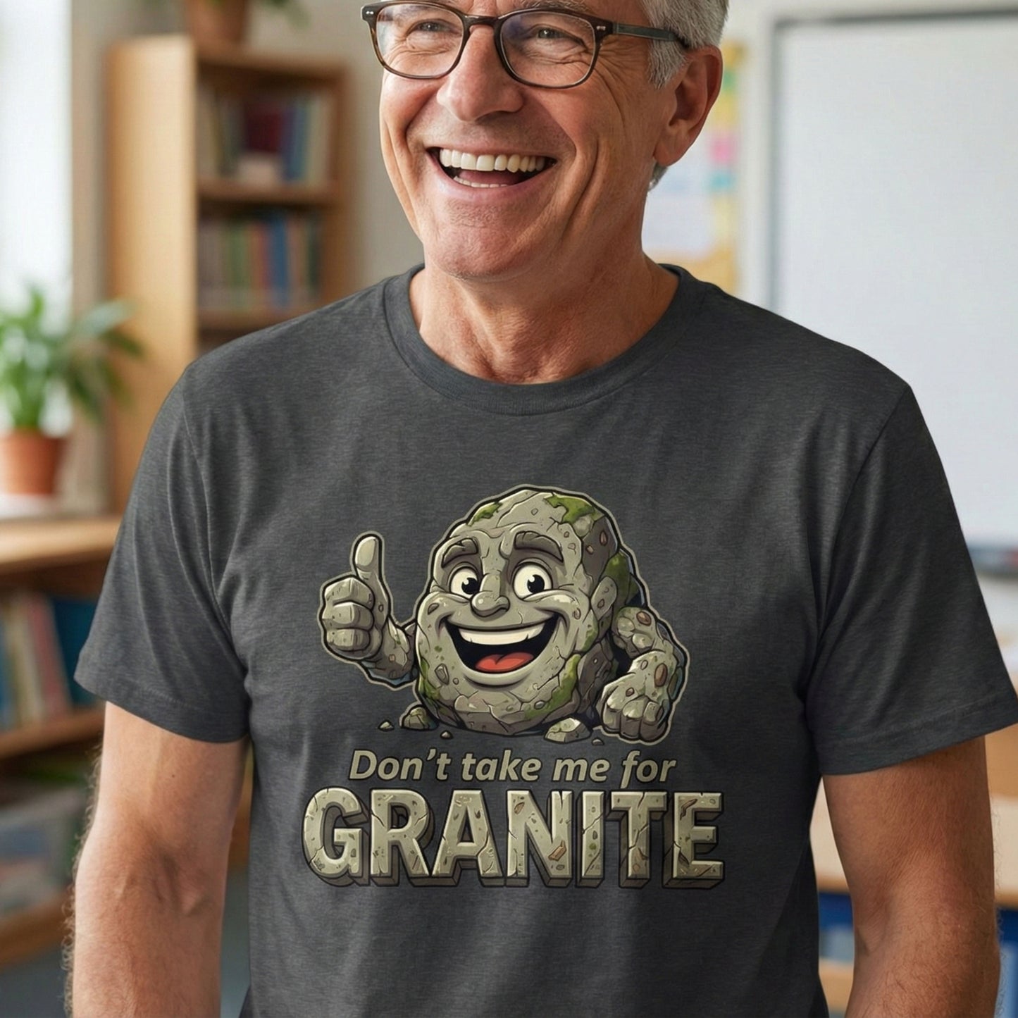 Man wearing a t-shirt with a cartoon character and text 'Don't take me for Granite' in a room.
