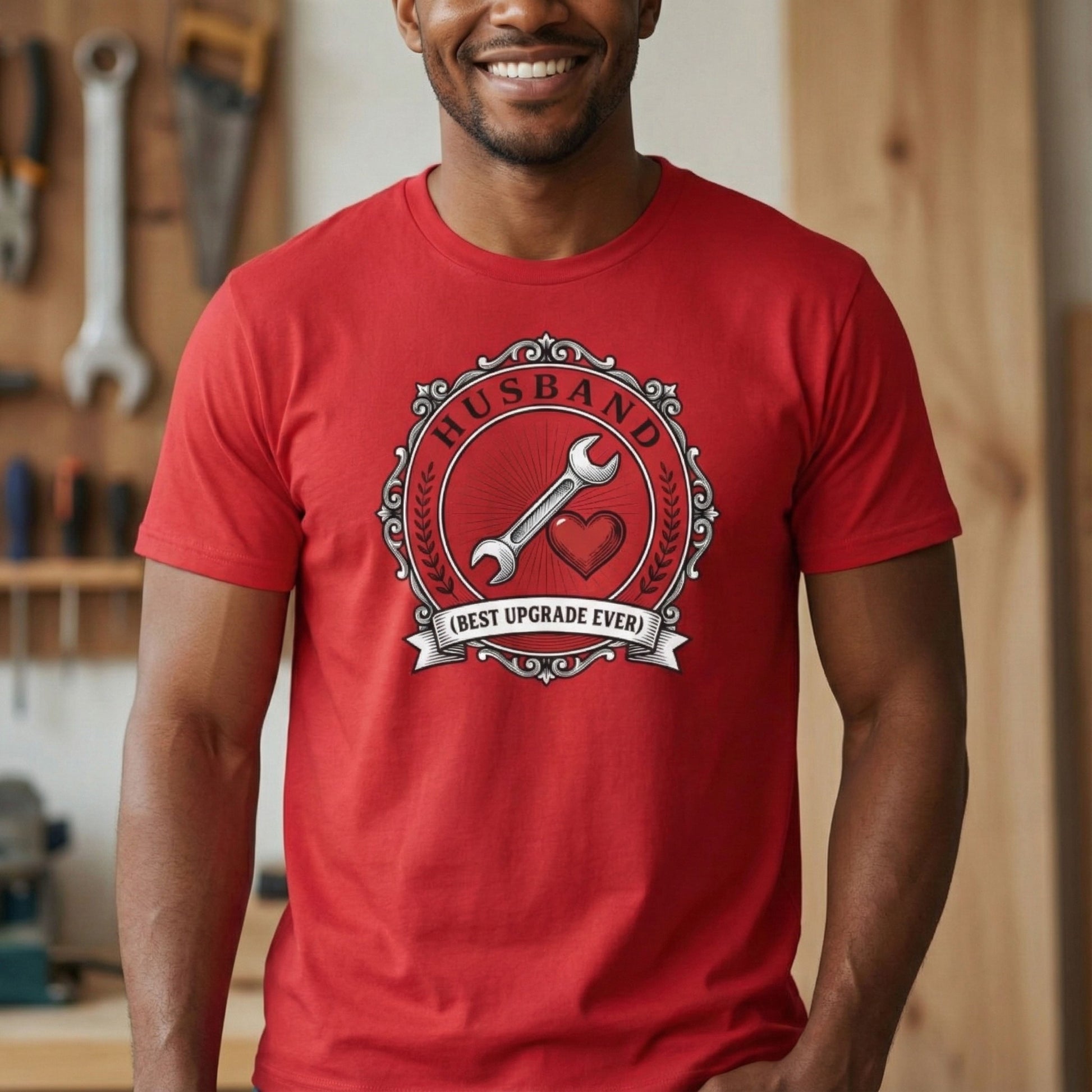 Man wearing a red t-shirt with a graphic design in a workshop setting