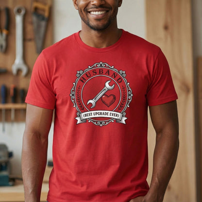 Man wearing a red t-shirt with a graphic design in a workshop setting