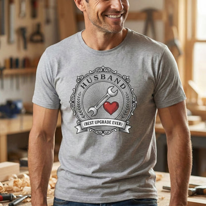 Man wearing a gray t-shirt with a graphic design in a workshop setting