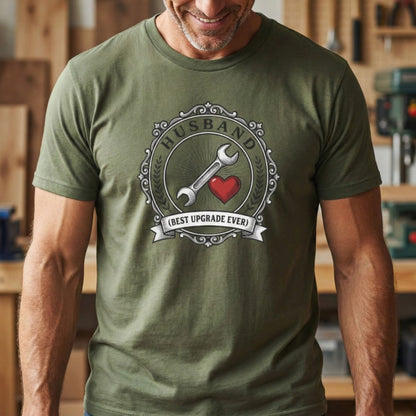 Man wearing a green t-shirt with a graphic design in a workshop setting