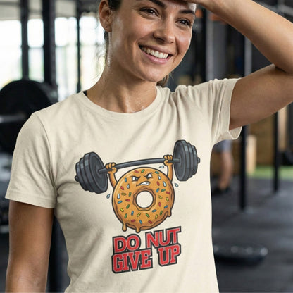 Person wearing a t-shirt with a donut lifting weights graphic and 'Do Not Give Up' text in a gym setting.