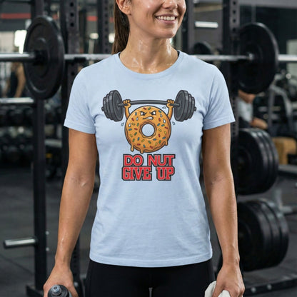 Person wearing a light blue t-shirt with a donut and barbell graphic and 'Do Not Give Up' text in a gym.