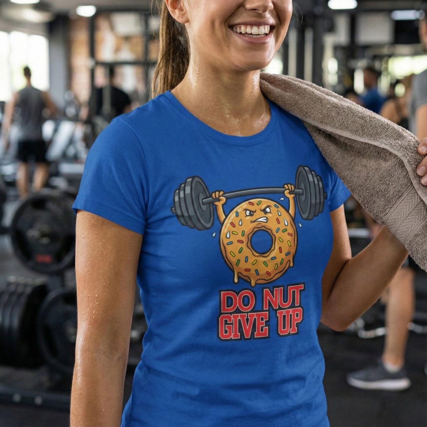 Person wearing a blue t-shirt with a donut lifting weights graphic and text 'DO NOT GIVE UP' in a gym setting.