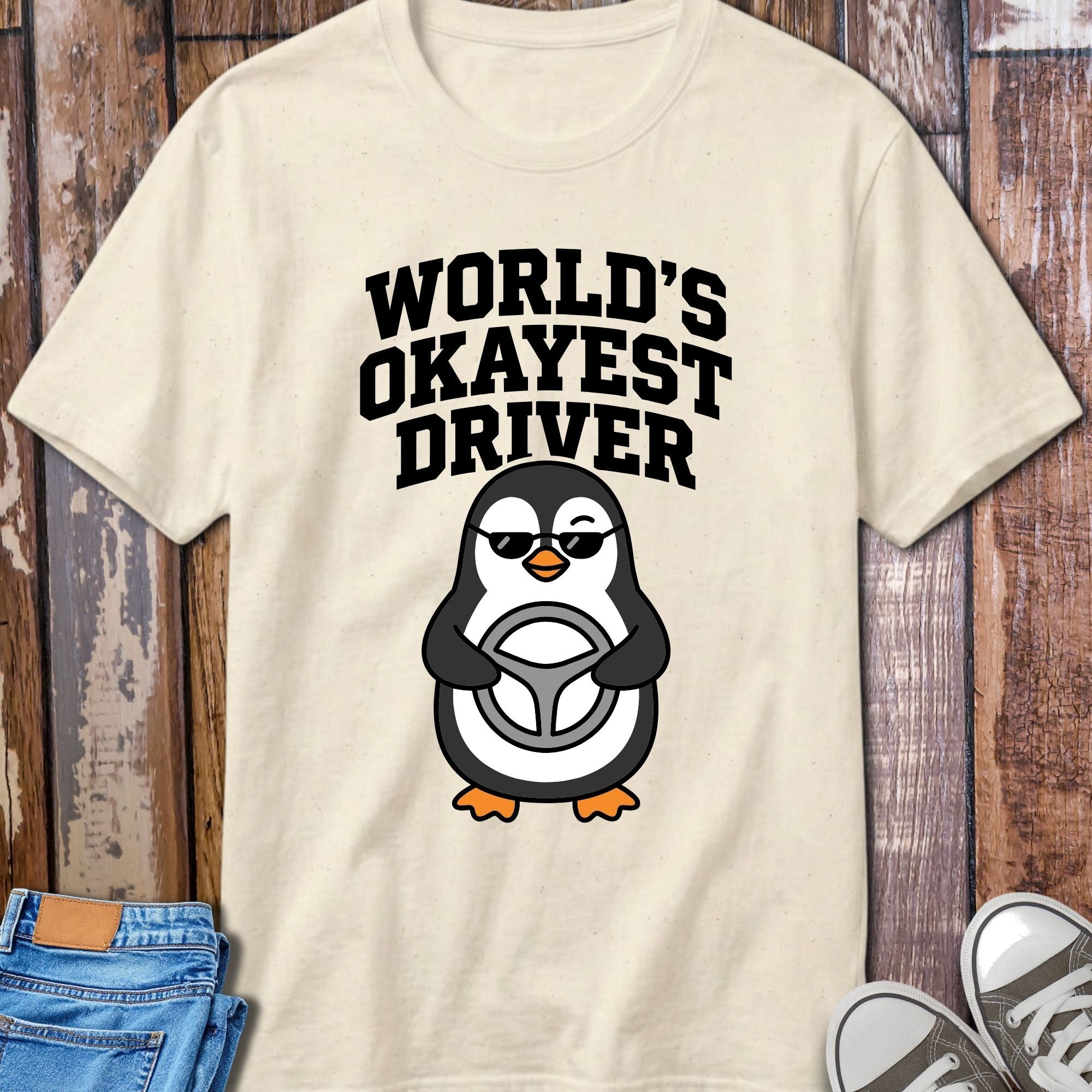 World's Okayest Driver T-Shirt - flat lay mockup on white background